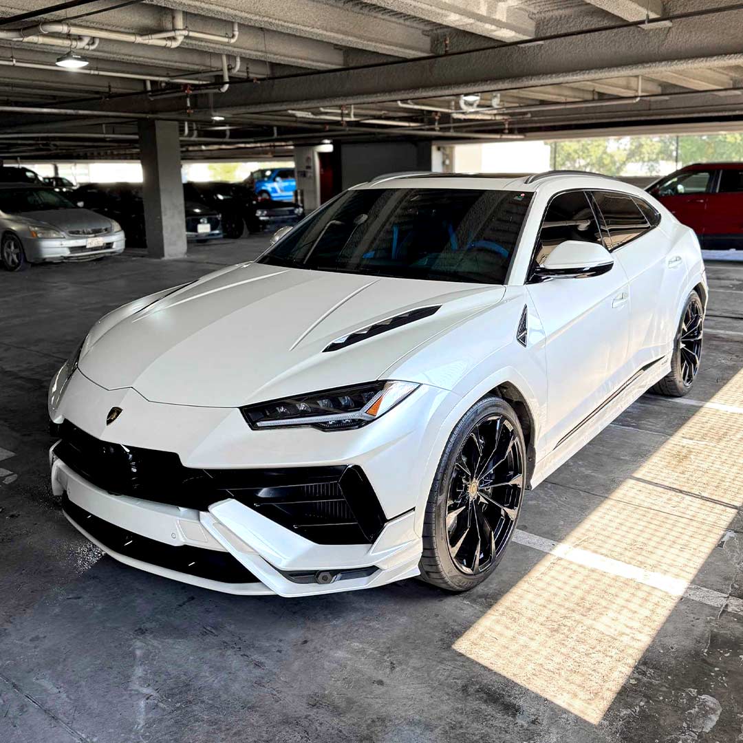 white lambo in parking garage