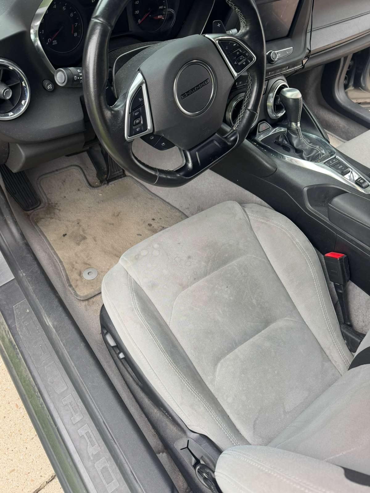 Dirty Camaro interior before professional interior detailing