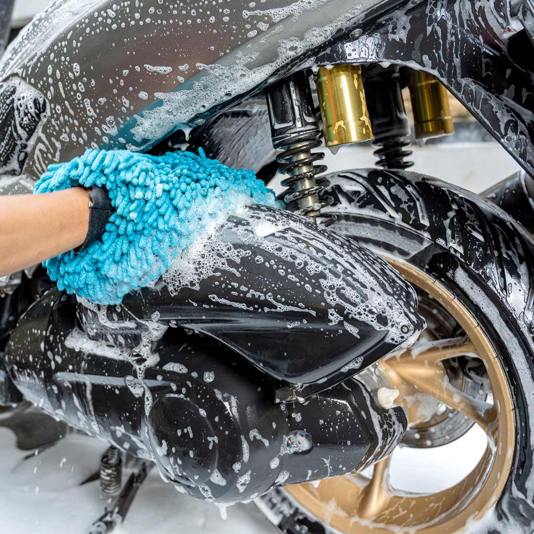 Motorcycle hand washing during professional detailing