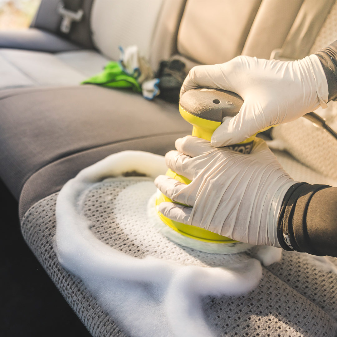 Deep cleaning cloth car seats during interior detailing