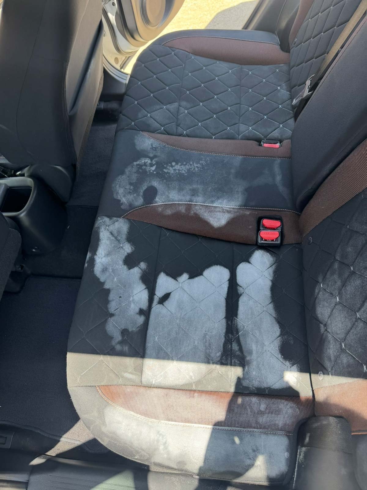 Stained cloth car seats before professional interior detailing